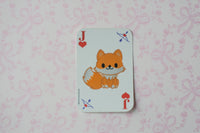 A Jack of Hearts playing card featuring a cute orange fox illustration in the center, displayed on a light pink patterned background.
