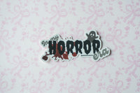 matte metalic sticker with a ghost saying 'in my horrow era'