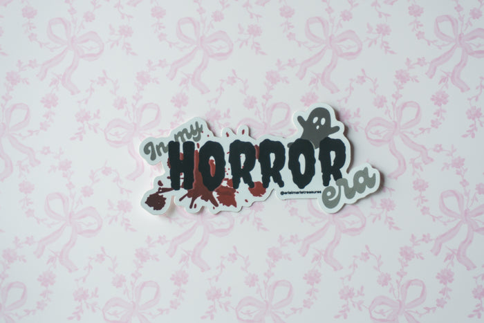 matte metalic sticker with a ghost saying 'in my horrow era'