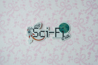 A die-cut sticker with the text 'In my Sci-Fi era' and space-themed illustrations, placed on a light pink floral bow patterned background.