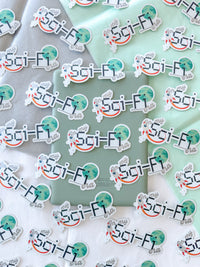 A close-up flat lay of repeated die-cut stickers featuring the text 'Sci-Fi Era' with a retro sci-fi character illustration, arranged over white and pale mint paper backgrounds.